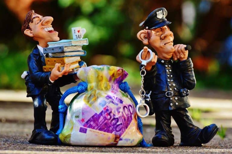 taxes tax evasion police handcuffs